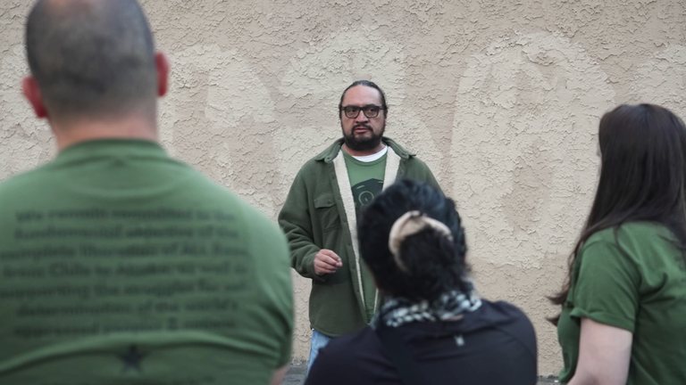 Francisco “Chavo” Romero, Union del Barrio, a volunteer group, attempting to spot immigration officials
