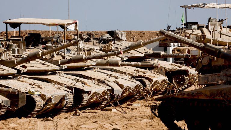 Israeli military vehicles stand near the Israel-Gaza border, in Israel.
Pic: Reuters