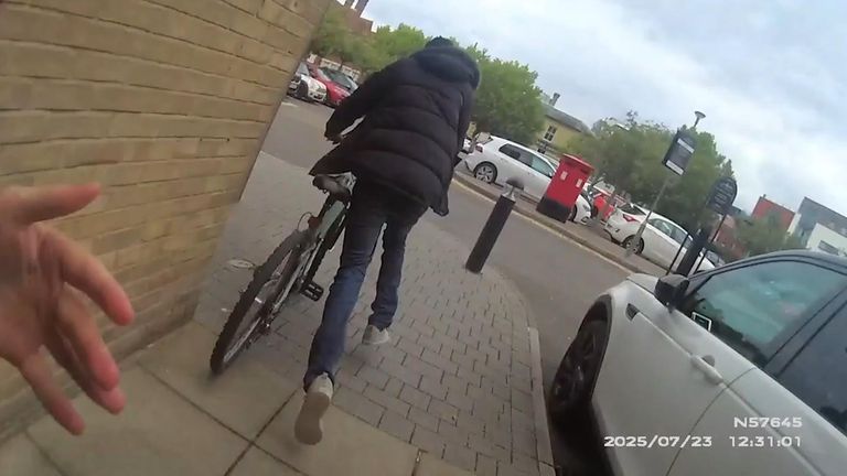 Still of police footage of actor Jeff Stewart who played PC Reg Hollis in The Bill helping arrest a shoplifter in Southampton