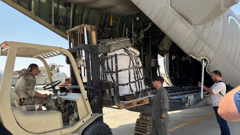 Jordanian military personnel prepare planes to deliver airdrops in Gaza on Monday