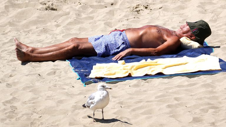 People enjoy the warm weather on Sunny Sands beach in Folkestone, Kent.
Pic: PA