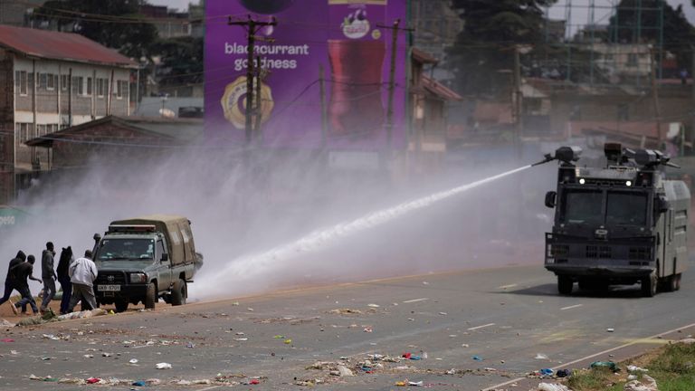  CLARIFIES DATE - Riot police scatter protesters with water cannons during demonstrations to mark the historic 1990 Saba Saba (a Swahili word that means seven seven) protests for democratic reforms in the Kangemi slum of Nairobi, Kenya, Monday, July 7, 2025. (AP Photo/Brian Inganga)