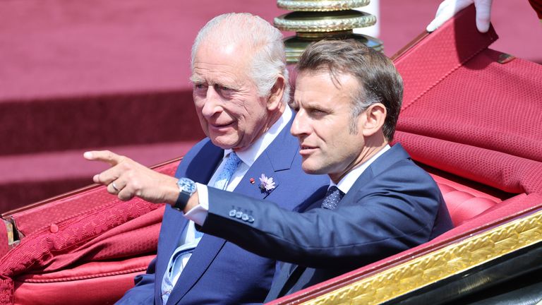 King Charles and President of France Emmanuel Macron  during the carriage procession.
Pic: PA