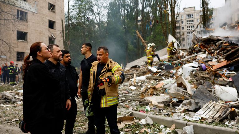 Ukraine's Prime Minister Yulia Svyrydenko, Interior Minister Ihor Klymenko and Head of the State Emergency Service Andrii Danyk stand at the