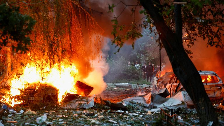 A car damaged during Russian missile and drone strikes burn, amid Russia’s attack on Ukraine, in Kyiv, Ukraine July 31, 2025. REUTERS/Valent