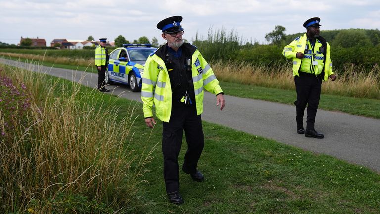 Police officers at the scene in Stathern, Leicestershire, after a 76-year-old man was arrested on suspicion of administering poison at a summer camp which led to eight children being taken to hospital. A triage centre was set up at a nearby village hall, and eight children were taken to hospital as a precaution and have all since been discharged, Leicestershire Police said. The man was arrested at the scene and remains in custody where he is being held on suspicion of administering poison/a noxious thing with intent to injure/aggrieve/annoy.  Picture date: Thursday July 31, 2025. PA Photo. Photo credit should read: Jacob King/PA Wire 