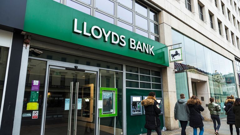 London, United Kingdom - January 1, 2017: Bank branch and ATM of Lloyds Bank with people around in London, England, United Kingdom