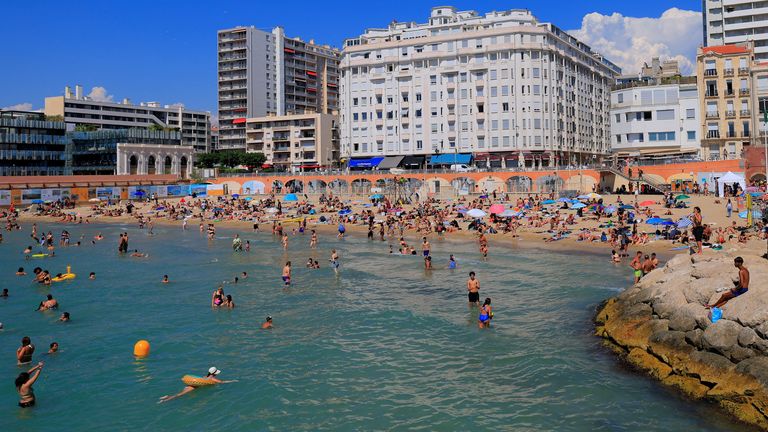 People sunbathe swim at the Beach of Catalans on a sunny and warm summer day in Marseille on July 1 Pic: Reuters
