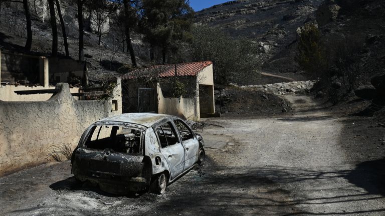 View of a burnt car and a destroyed house caused by a wildfire in the L'Estaque district of Marseille, southern France, July 9, 2025. REUTER