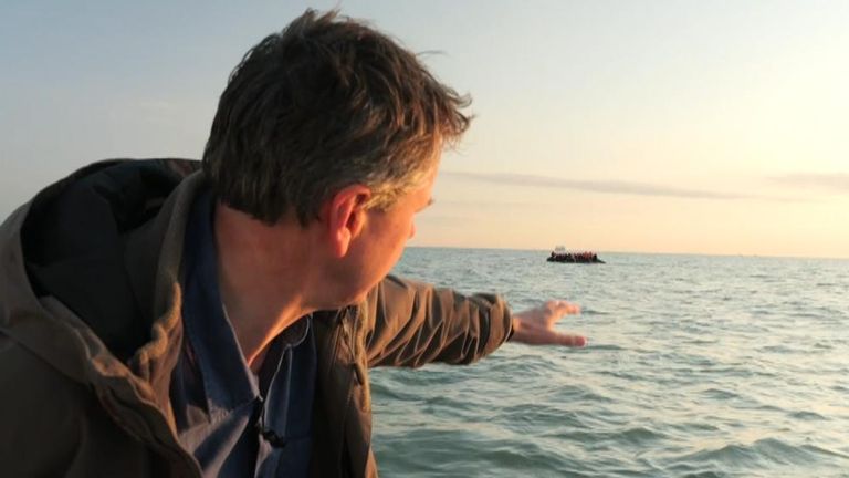 Adam Parsons observes a small boat carrying migrants
