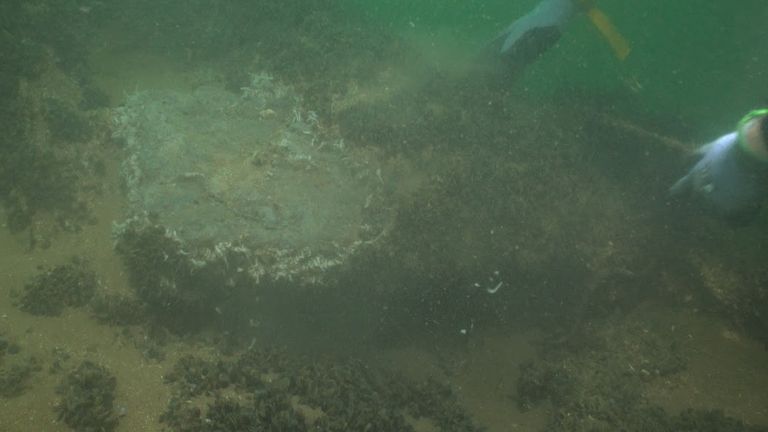 A diver with a wooden chest emerging from the wreck site. 
Pic: Pascoe Archaeology