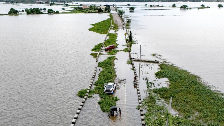 A drone view shows a flooded road in the middle of a swollen swamp following heavy rains brought by Typhoon Co-may in Candaba, Pampanga, Philippines, July 25, 2025. REUTERS/Eloisa Lopez
