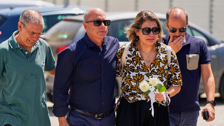 Joaquim, center, father of Liverpool forward Diogo Jota and his brother, arrives accompanied by other relatives at a church where their bodies have been brought for a wake and funeral, in Gondomar, near Porto, Portugal, on Friday, July 4, 2025.