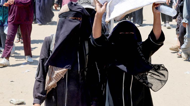 Palestinians react as they seek aid supplies from the U.S.-backed Gaza Humanitarian Foundation, near Rafah.
Pic: Reuters