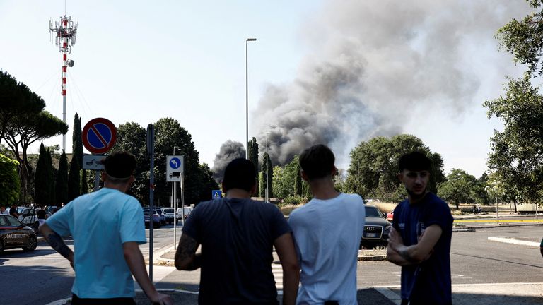 Smoke rises in distance after explosion. Pic: Reuters