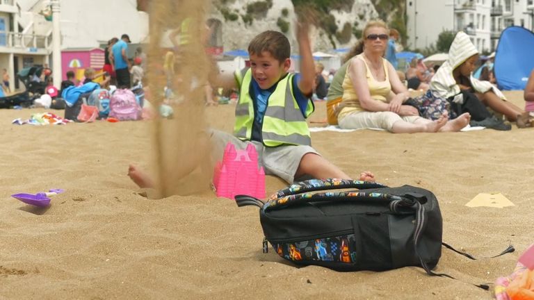 A boy plays in the sand