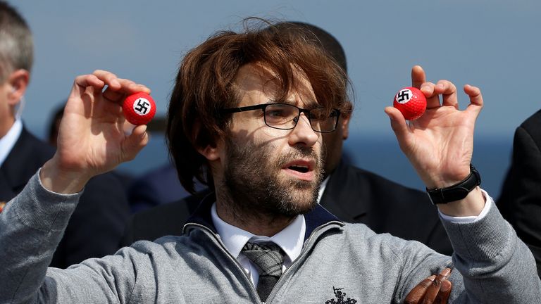 Simon Brodkin (aka Lee Nelson) is removed from a press conference by Republican presidential candidate Donald Trump at Turnberry Golf course