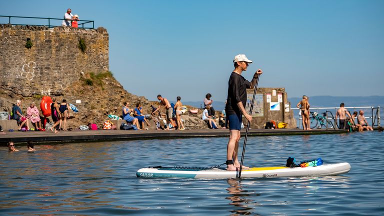 People enjoy the water at Clevedon Marine Lake, Somerset.
Pic: PA