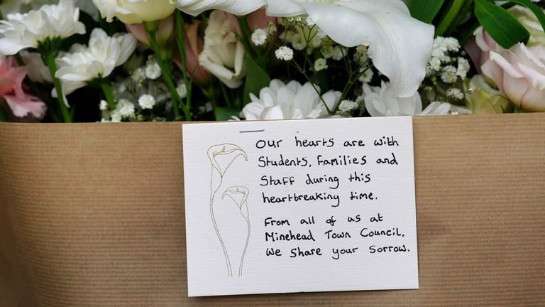 A note left on a bunch of flowers at school