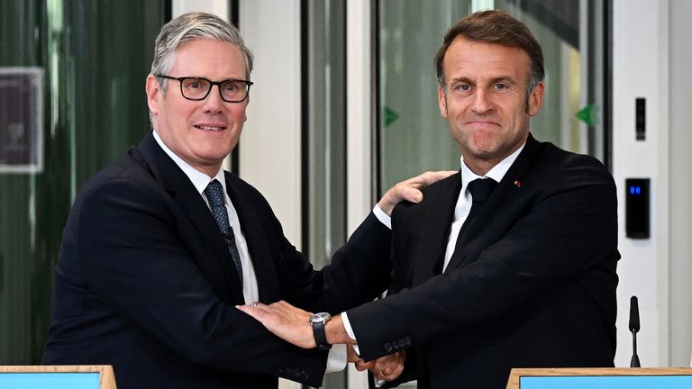 The British and French leaders after announcing the new migrant return pilot scheme.
Pic: PA