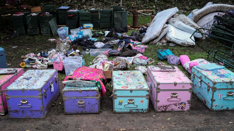 Camper's belongings lie on the ground following flooding on the Guadalupe River, at Camp Mystic.
Pic: Reuters
