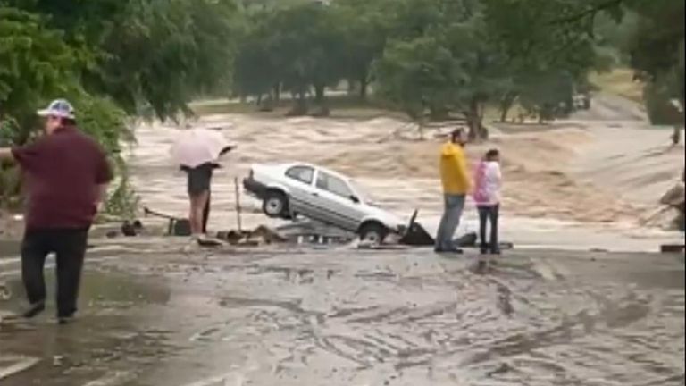 Car is wedged in the ground following deadly floods in Texas