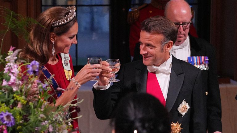 Emmanuel Macron and Kate, the Princess of Wales, share a toast. Pic: PA