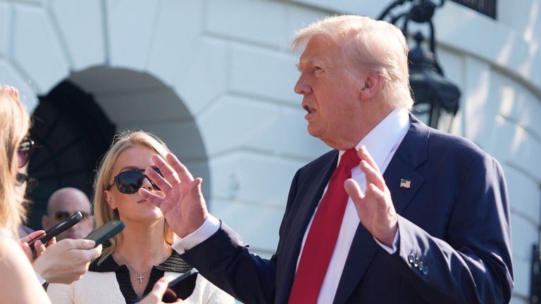 President Donald Trump speaks with reporters before departing on Marine One from the South Lawn of the White House, Friday, July 25, 2025, in Washington. The President is traveling to Scotland. (AP Photo/Alex Brandon)
