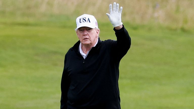 U.S. President Donald Trump waves on the golf course at Trump Turnberry resort in Turnberry, Scotland, Britain, July 26, 2025. REUTERS/Phil 