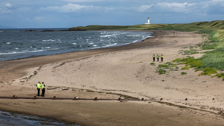 Police officers patrol the area where US President Donald Trump plays golf at his Trump Turnberry golf course in South Ayrshire, as he begin