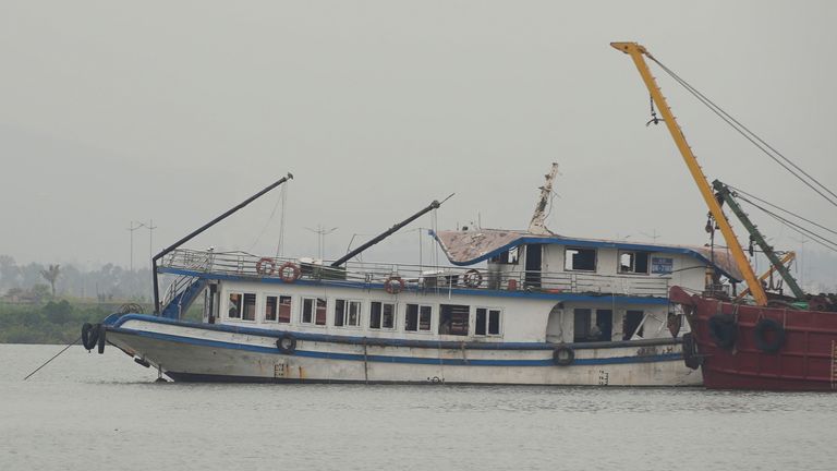 The Wonder Sea is towed to a shipyard after capsizing. Pic: (Huy Han/AP)