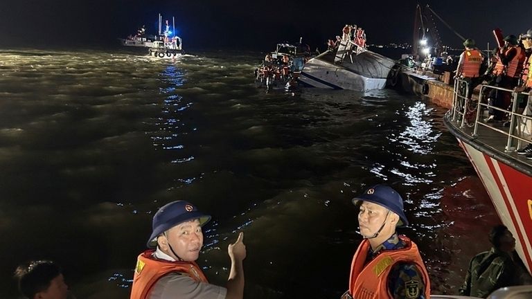 Rescue workers searching for people in Ha Long Bay, Vietnam. Pic: QDND via AP