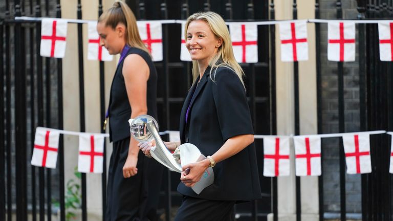 England's team captain Leah Williamson carries the trophy when leaving a special reception, to celebrate their victory in the Women's Euro 2025 final, at Downing Street in London, Monday, July 28, 2025. (AP Photo/Kirsty Wigglesworth)