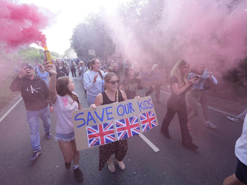 Hundreds gather for protest outside 'migrant' hotel