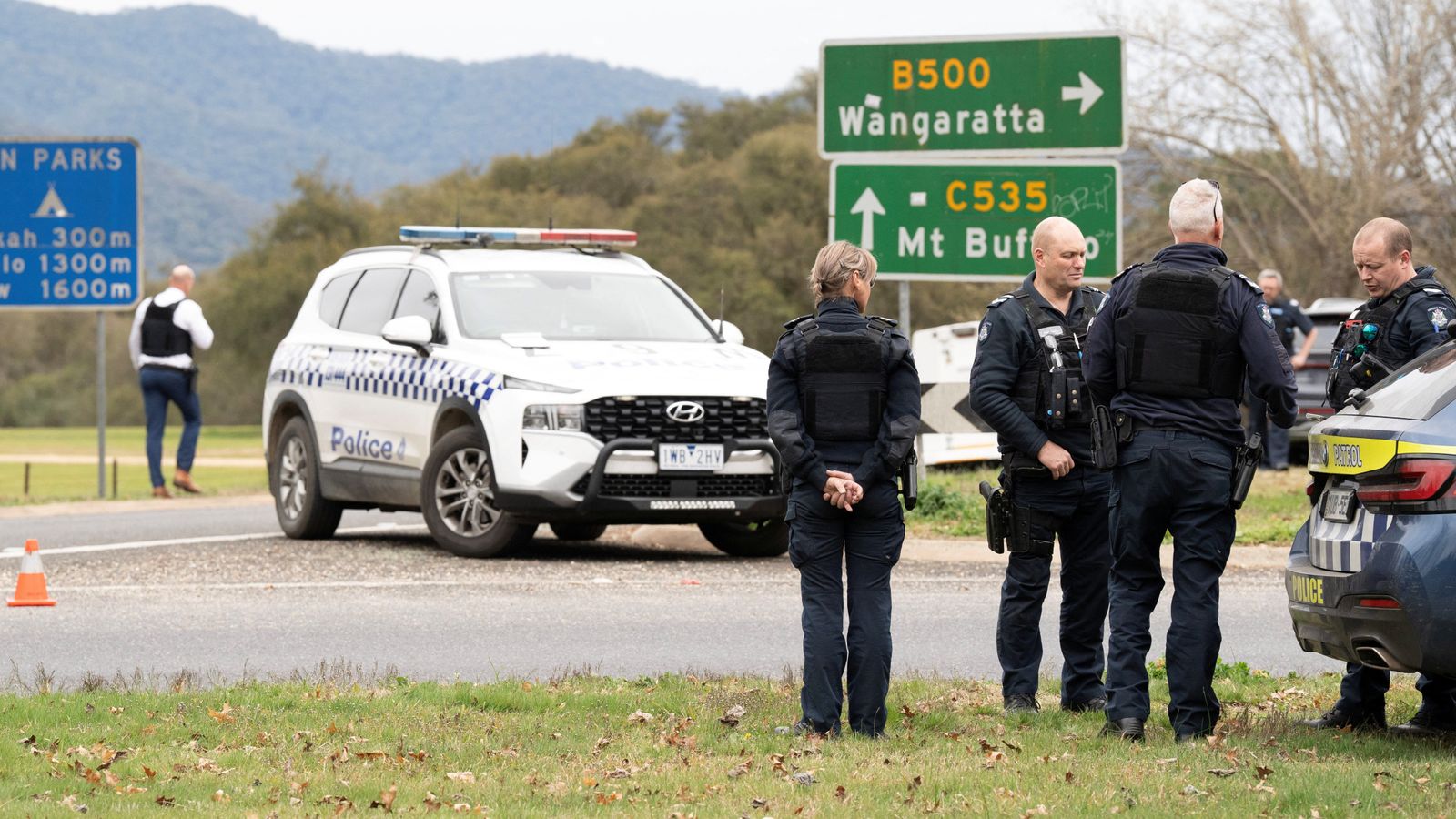 Manhunt under way after two police officers shot dead in rural ...