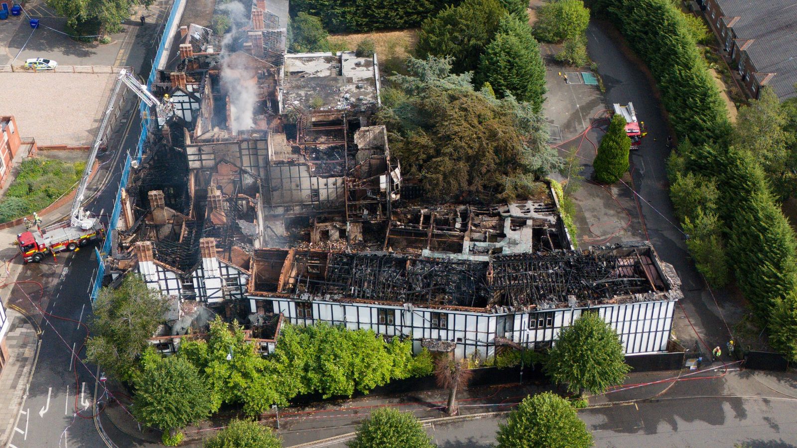 Two girls arrested after historic hotel destroyed in suspected arson ...