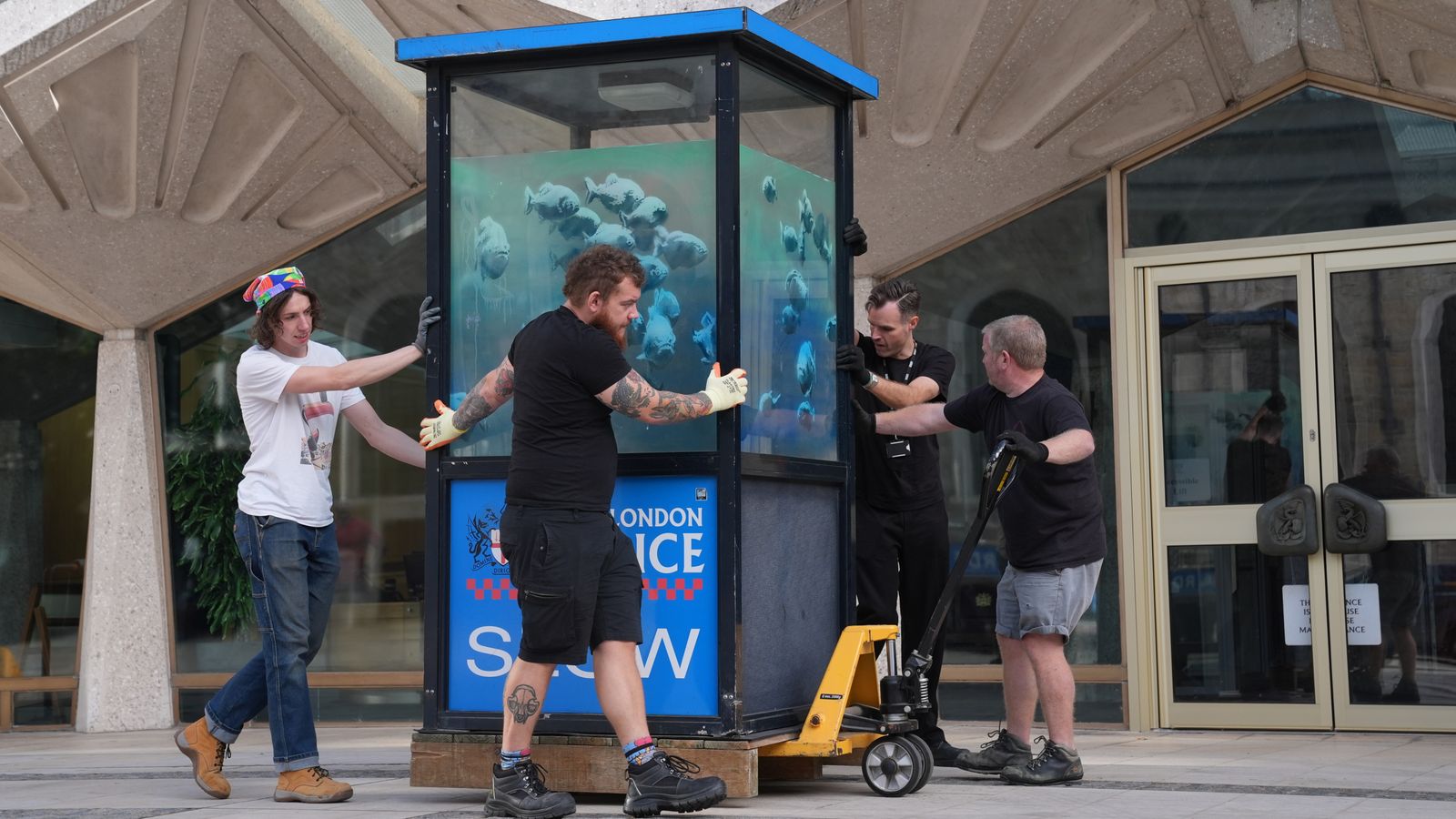 Banksy's piranhas police box put in protective storage ahead of museum display