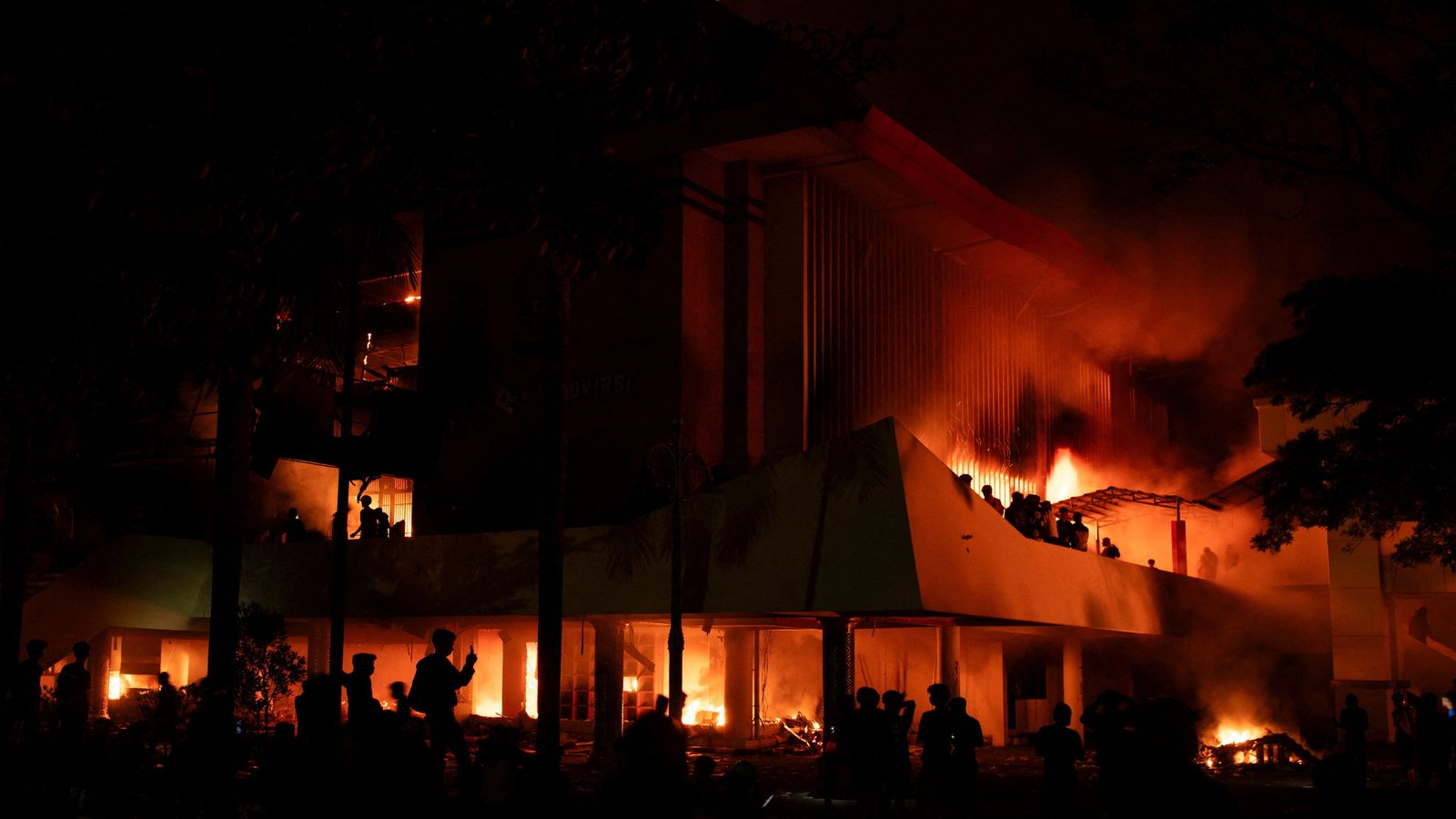 At least three dead after Indonesian parliament building set ablaze - as violent protests rage on