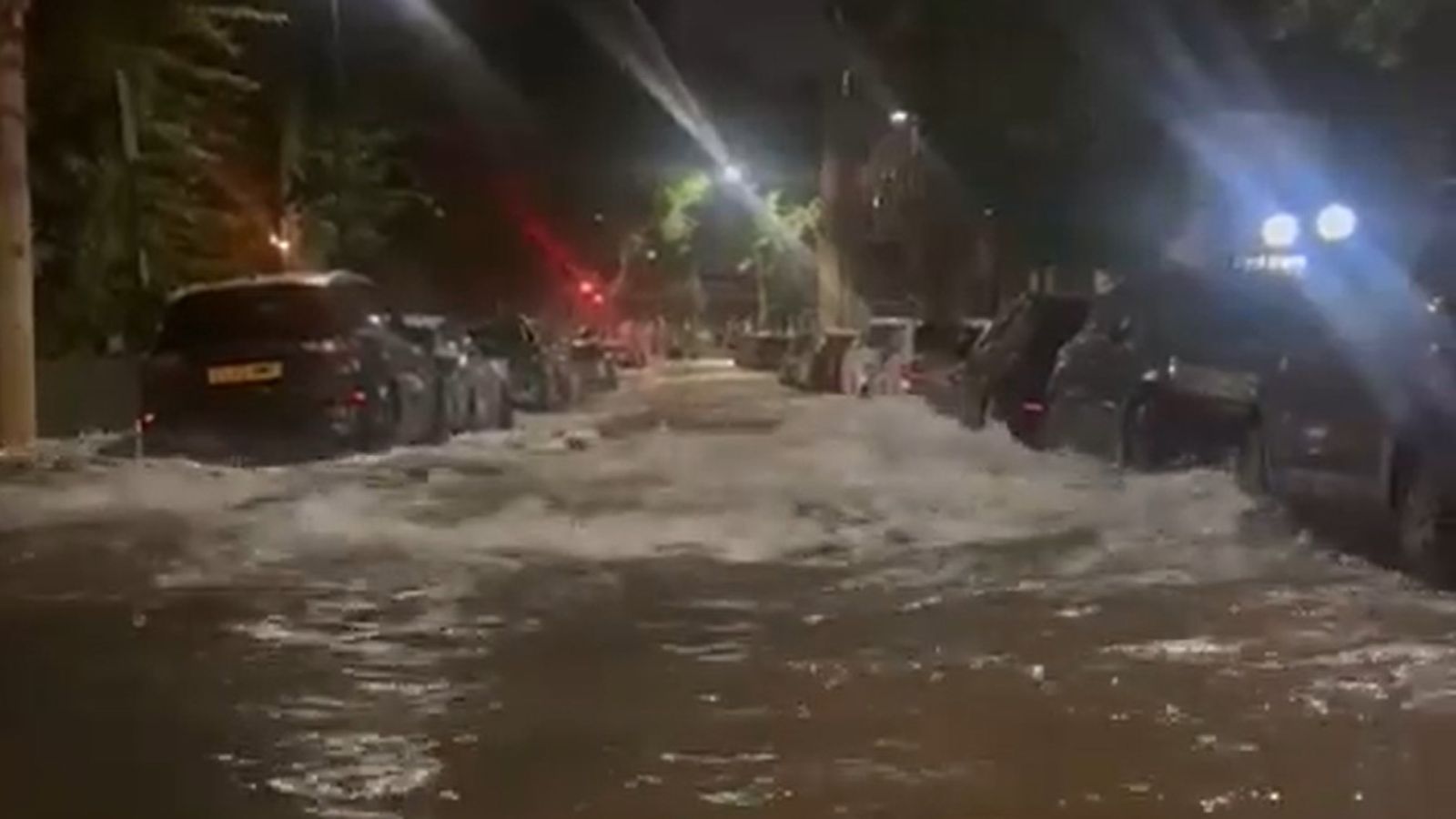 Dozens evacuated after burst water main floods streets in north London