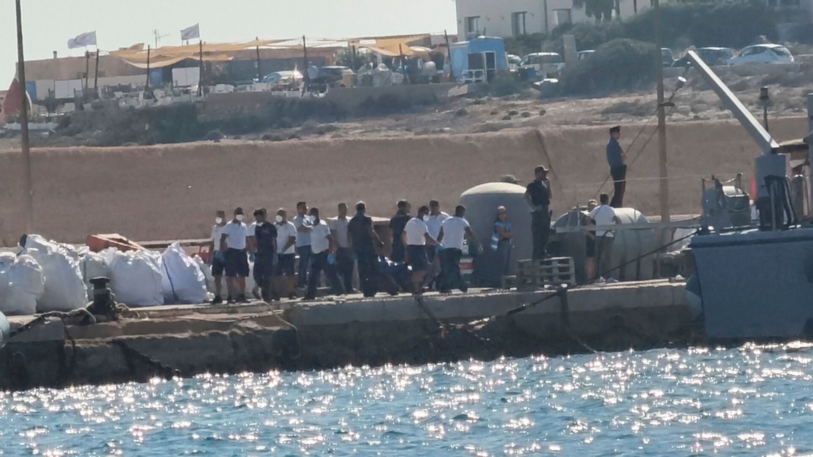 At least 26 dead and around a dozen missing after boat capsizes off Italian island
