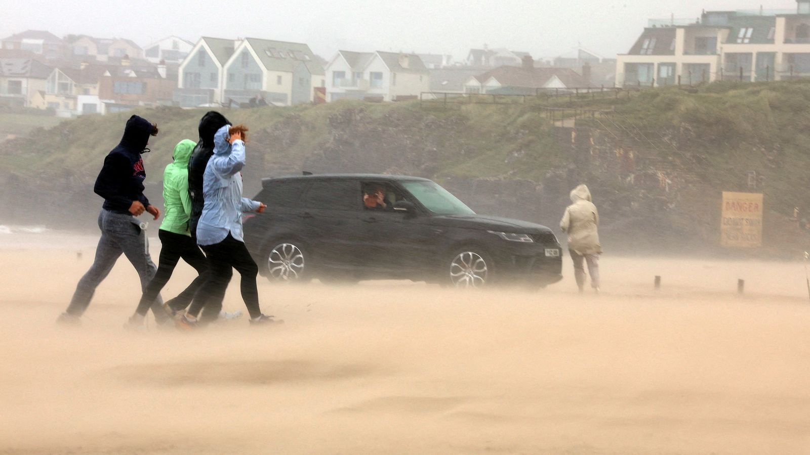 Storm Floris latest: Winds up to 124mph hit UK – as 32,000 homes without power and plane filmed struggling to land | UK News