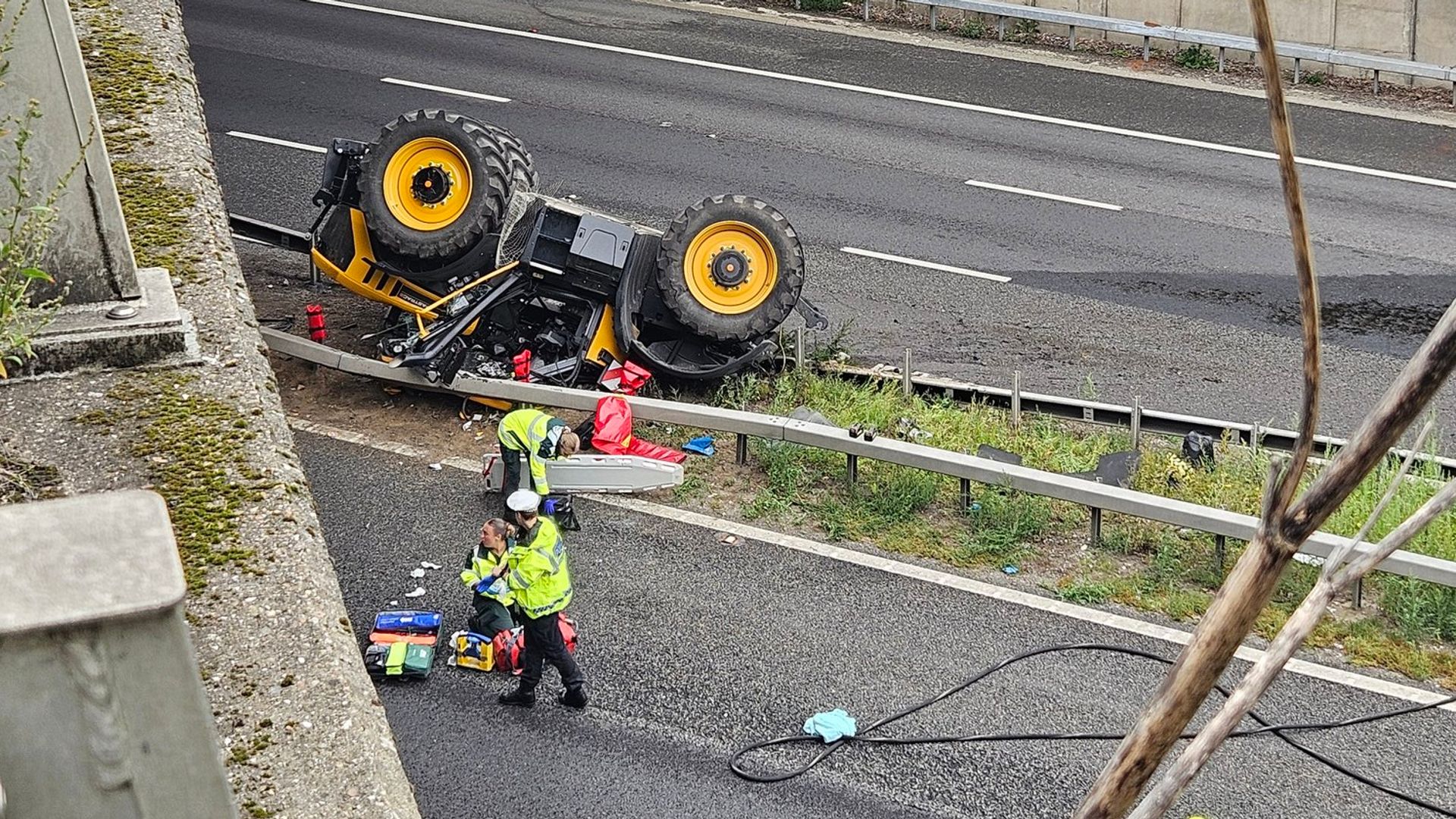 Man seriously injured after tractor falls off bridge on to motorway