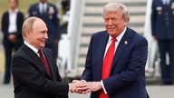 U.S. President Donald Trump shakes hand with Russian President Vladimir Putin, as they meet to negotiate for an end to the war in Ukraine, a