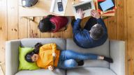 A family living room scene with people using the internet. Pic: iStock