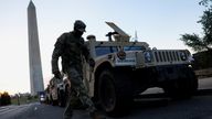 U.S. Army National Guard Humvees park near the Washington Monument after U.S. President Donald Trump announced a federal takeover of the Met