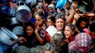 Palestinians wait to receive food from a charity kitchen, in Khan Younis, southern Gaza Strip.
Pic: Reuters