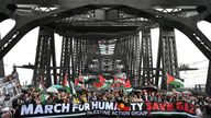 Protesters walk across the Sydney Harbour Bridge. Pic: AAP/Dean Lewins/Reuters