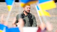 Ukrainian President Volodymyr Zelenskyy surrounded by Ukraine flags in 2023. Pic: Reuters