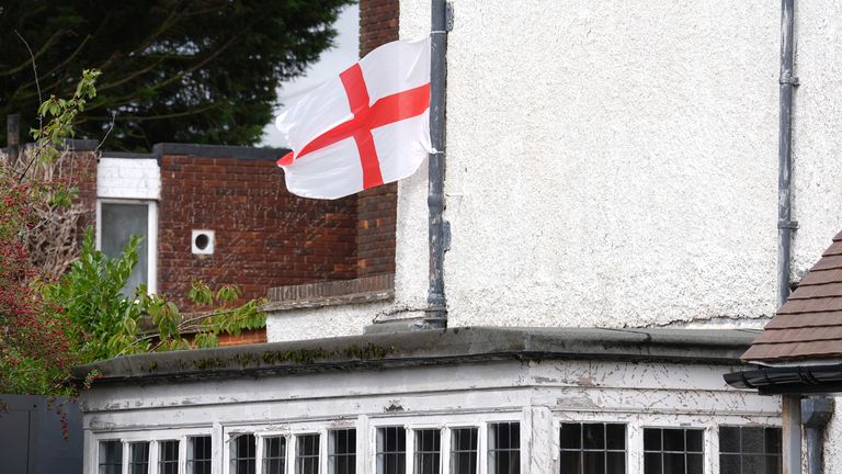 A view of an England flag outside the Bell Hotel in Epping, Essex, after a temporary injunction that would have blocked asylum seekers from being housed at the Bell Hotel in Epping, Essex, was overturned at the Court of Appeal. Picture date: Friday A