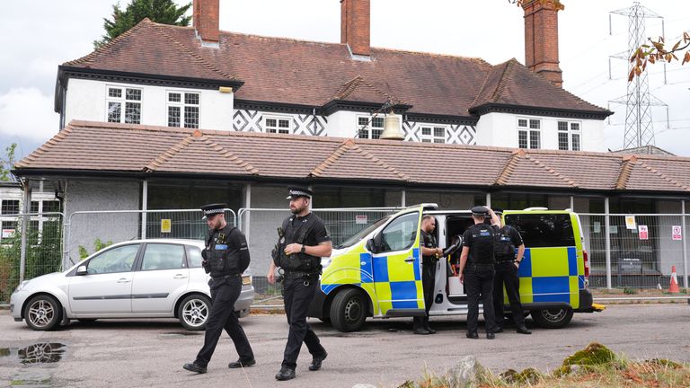 Police outside the Bell Hotel in Epping on Friday. Pic: PA